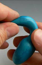 Blue clay being shaped